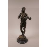 A bronze figure of an African musician, 16" high