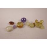A collection of carved agate, amethyst and hardstone fruits, largest 2"