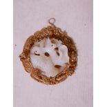 A Chinese white jade and gilt filigree mounted pendant with carved duck and lotus flower decoration,