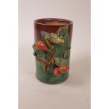 A Chinese green crackle glazed pottery brush pot with applied bird and fruit decoration and flambe