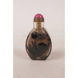 A Chinese glass snuff bottle with carved rabbit decoration, 2½" high