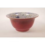 A Chinese blue and white crackleware bowl with red glaze, the interior decorated with kylin and