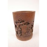 A bamboo brush pot with carved decoration, 6" high x 4½" wide