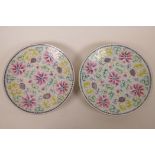 A pair of early C20th Chinese cabinet plates with polychrome floral decoration, one A/F, repairs,