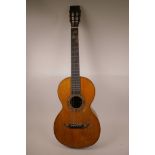 A Spanish accoustic guitar with rosewood body and mother of pearl inlaid decoration, 38" long