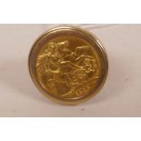 A 1965 set gold sovereign signet ring in 9ct gold mount, size R, gross 13.5g