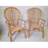 A pair of vintage bamboo and cane open armchairs