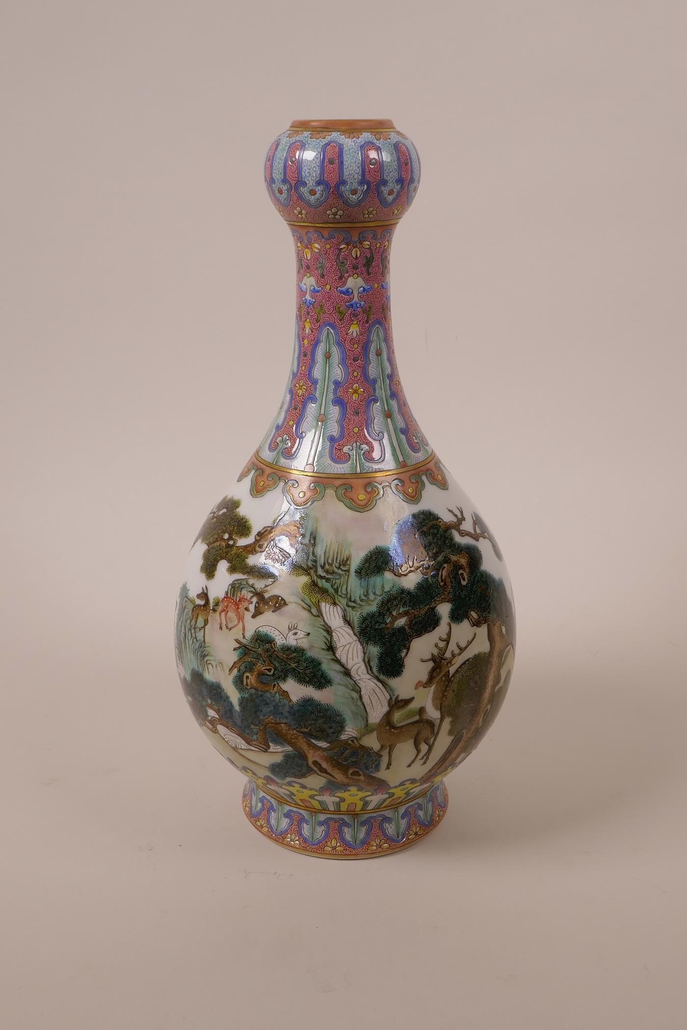 A Chinese polychrome porcelain garlic head vase, decorated with deer in a woodland, seal mark to