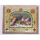 A C19th eglomise and reverse painted still life of fruit, with Gothic revival decoration, in a