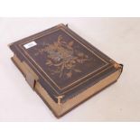 A Victorian gilt tooled leather musical photo album, opens and plays Auld Langs Ayne, 9" x 12" x 3"