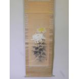 A Japanese watercolour scroll with blue and white porcelain mounts, decorated with chrysanthemums,