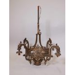 A French brass four branch chandelier, 32" drop, 28" diameter