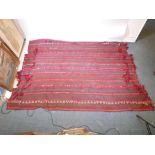 A hand woven wool Bedouin Kilim, with geometric designs, from the Negev desert, 79" x 108"
