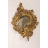 An early C19th carved and gilt wood pier glass mirror, 10" x 7"