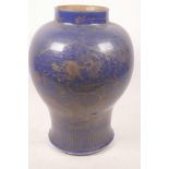 A Chinese porcelain powder blue vase with gilt decoration of a dragon and phoenix, 13½" high