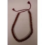 A long string of amber style beads, 41" long