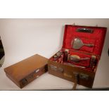 A matched part hallmarked silver mounted vanity set in a fitted leather case, together with a
