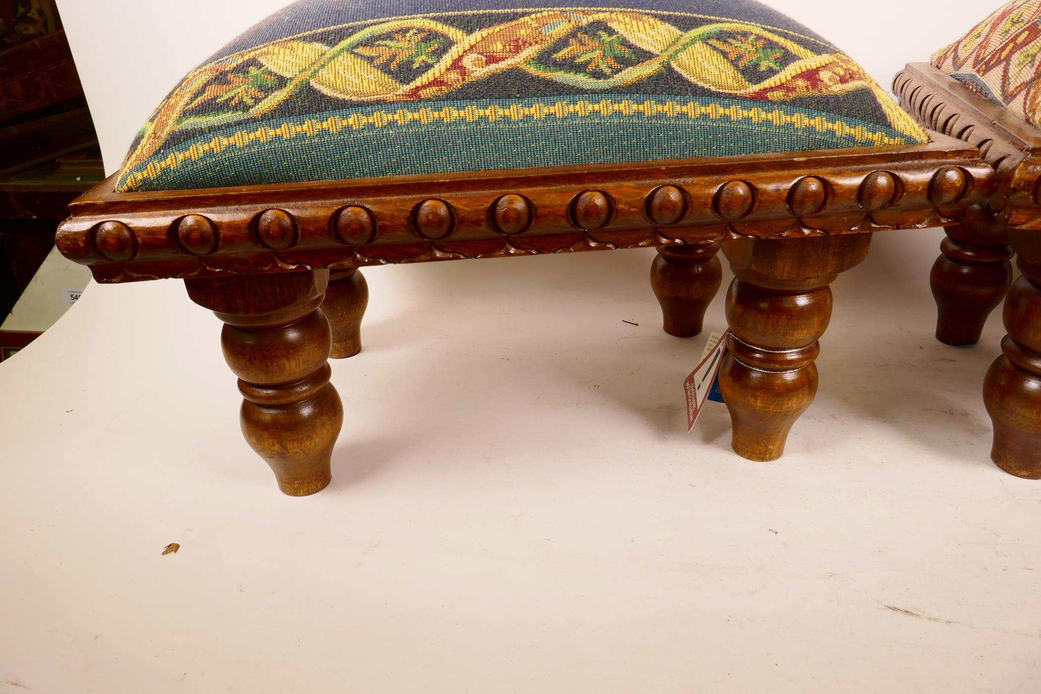 A pair of contemporary footstools with carved decoration on turned supports, the upholstered tops - Image 2 of 4