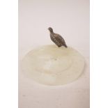 An onyx ashtray with bronze partridge, 4½" wide