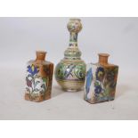 Two middle Eastern bottle jars with underglaze decoration of fish and flowers, and an earthenware