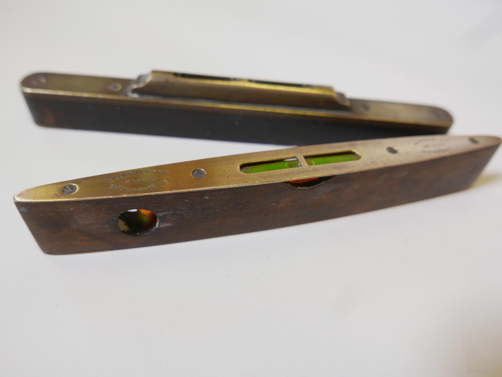 A vintage J. Rathbone and Sons No.1626 rosewood and brass spirit level, 9" long, together with an