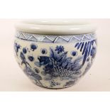 A Chinese blue and white porcelain jardiniere decorated with carp in a pond, 10" high x 15" diameter