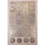 A set of twelve Chinese silvered metal trade tokens depicting the Zodiac animals, together with four