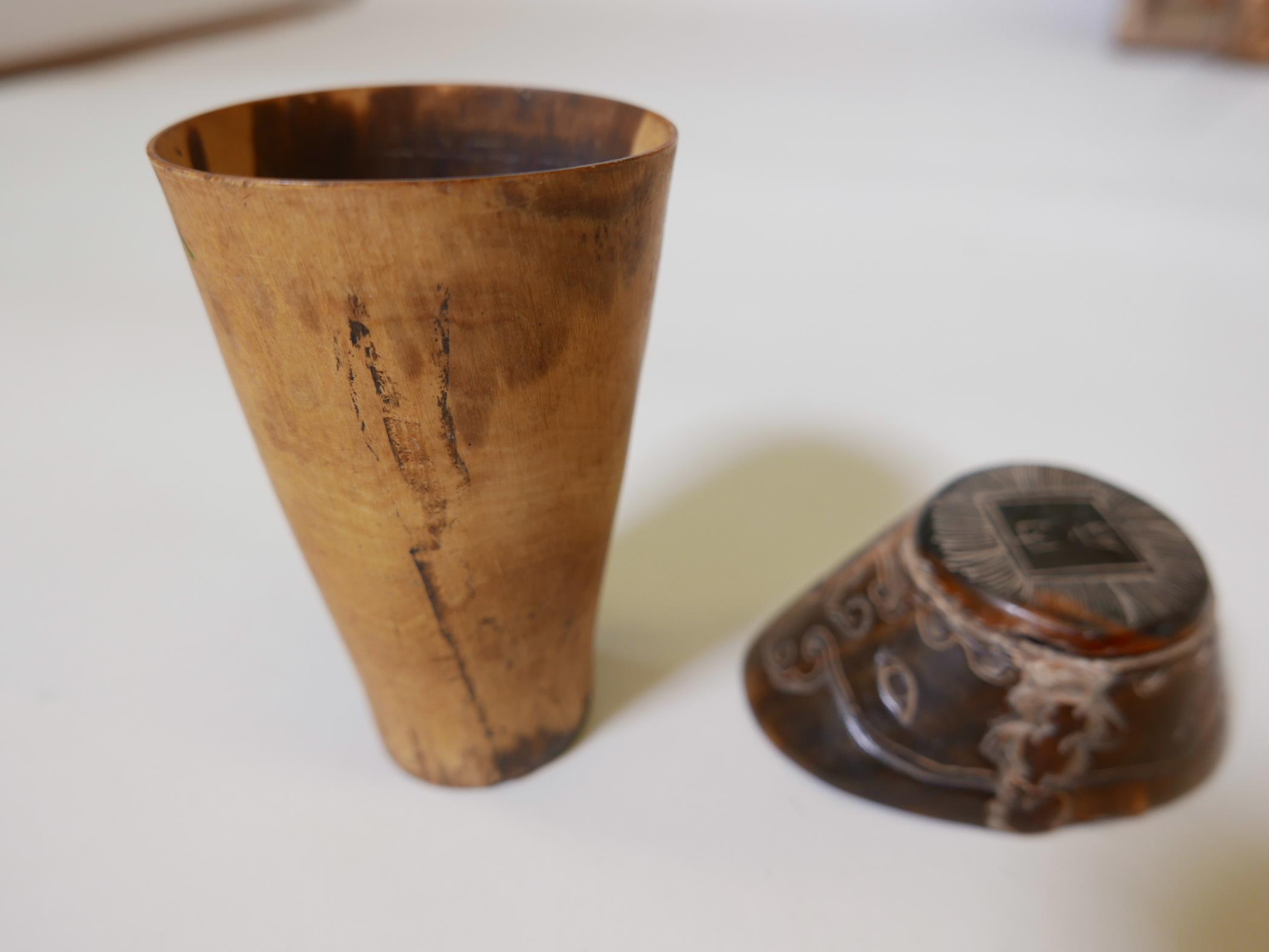 A Chinese hoof and horn paper weight carved with symbols and calligraphy, 4" long, together with