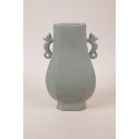 A Chinese celadon glazed two handled pottery vase, raised two character mark to base, 9" high