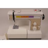 A Toyota 2200 series electric sewing machine, comes with manual, accessories and original box