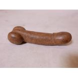 An Oriental carved hardstone phallus, 8" long