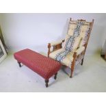 An Edwardian upholstered armchair and a Long John footstool