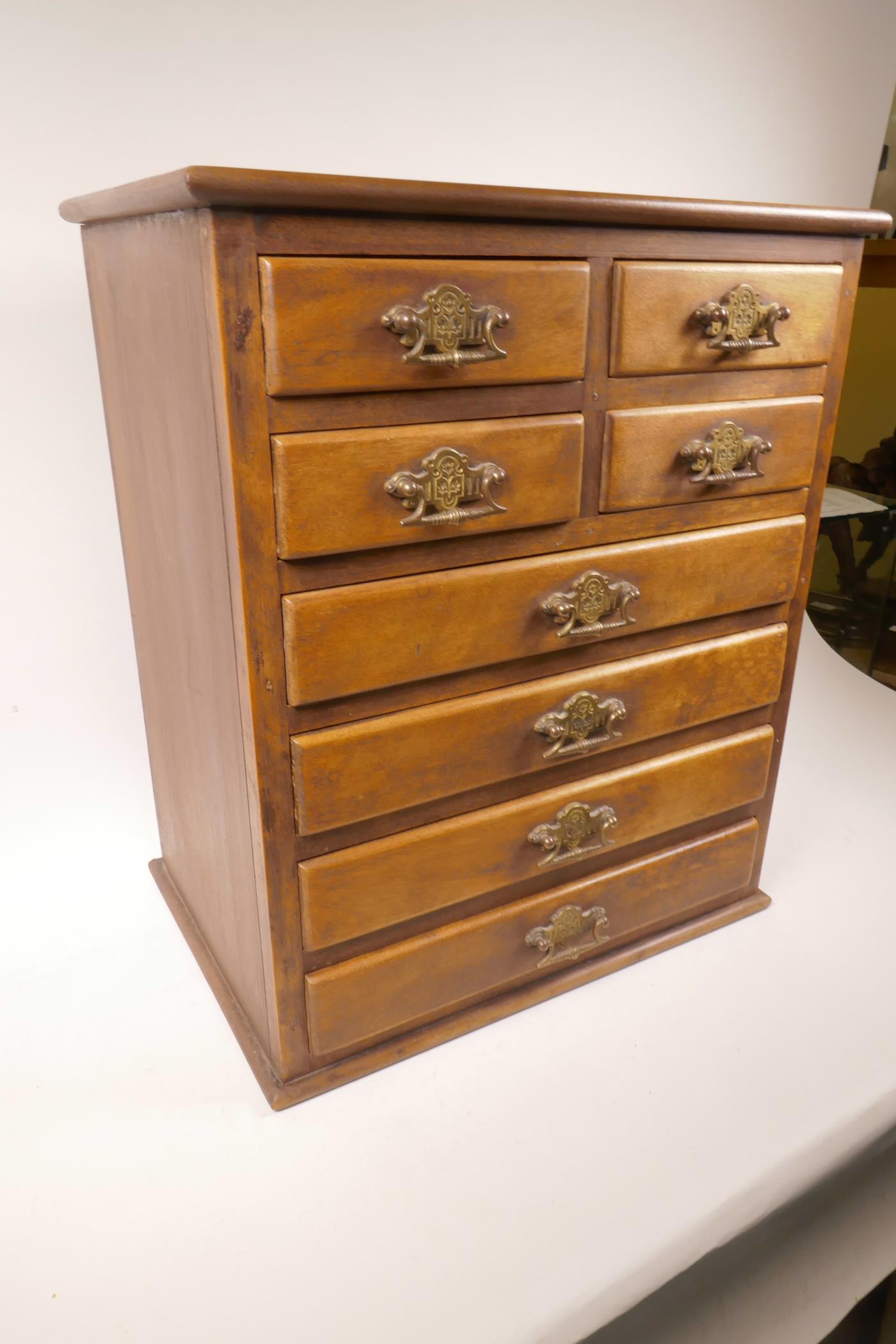 A small hardwood chest of four short over 4 long drawers with brass drop handles, 19" x 16" x 11" - Image 2 of 4