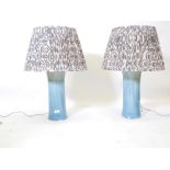 A pair of ceramic table lamps with drip blue glaze, lamp 16" high, with shade 28" high