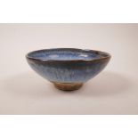 A Chinese pottery bowl with a blue flambe glaze, 7½" diameter