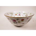 A large Chinese Export bowl with butterfly, fruit and foliage decoration on a white ground, label to