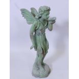A patinated cast metal garden figurine of a fairy drinking from a leaf, 20" high