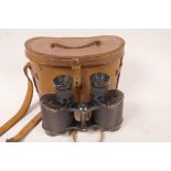 A pair of Watson Baker Ltd WWII binoculars bearing Air Ministry stamps and dated 1943, in original