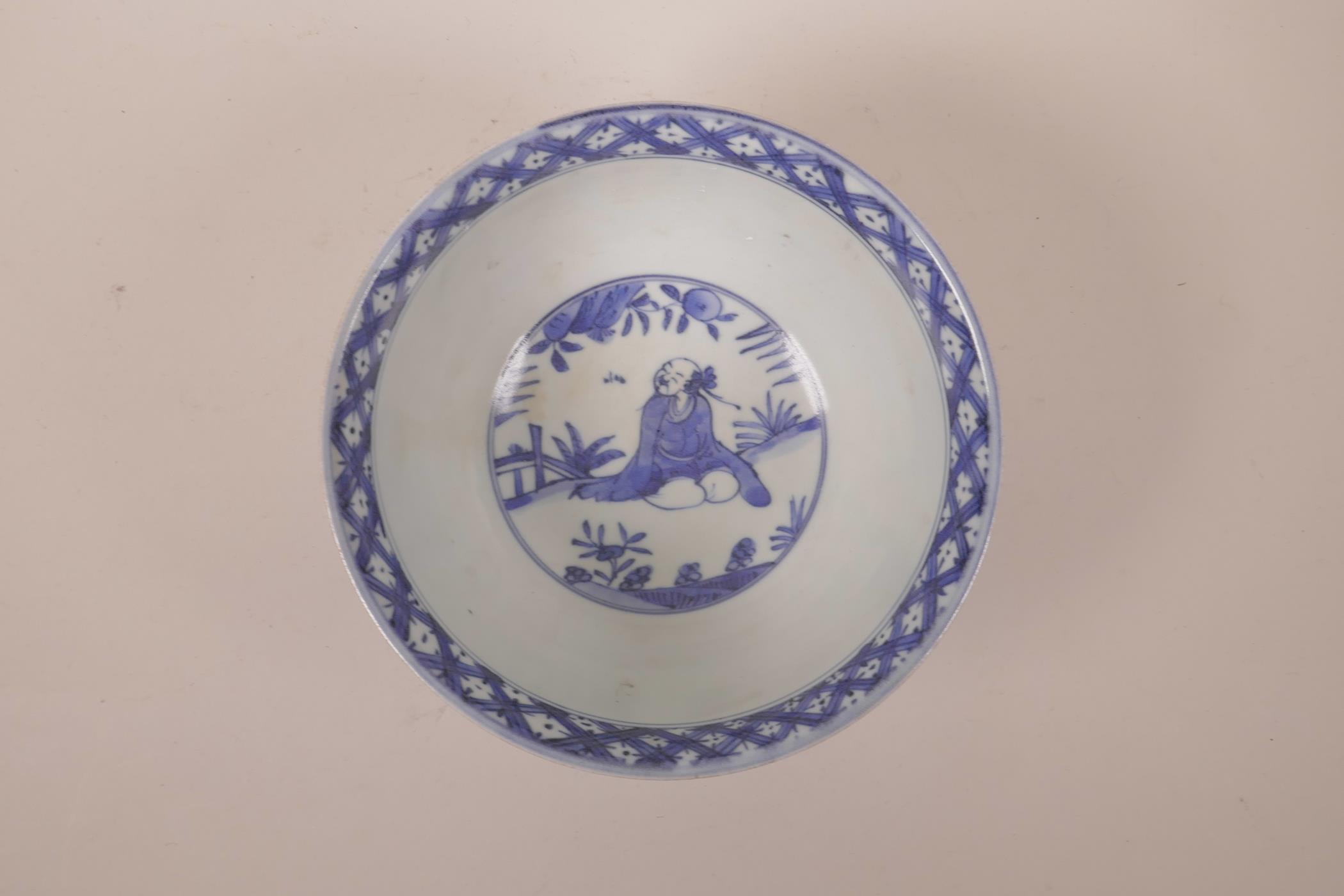 A Chinese blue and white porcelain rice bowl decorated with figures in a garden, six character - Image 2 of 6