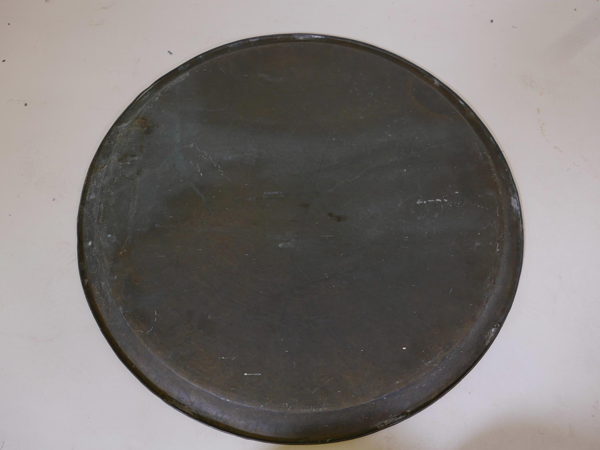 A Middle Eastern copper tray with Islamic calligraphy decoration, 24" diameter - Image 6 of 6