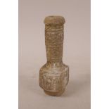 An Indo Persian soapstone spill vase with carved decoration of a crowned head, 5½" high