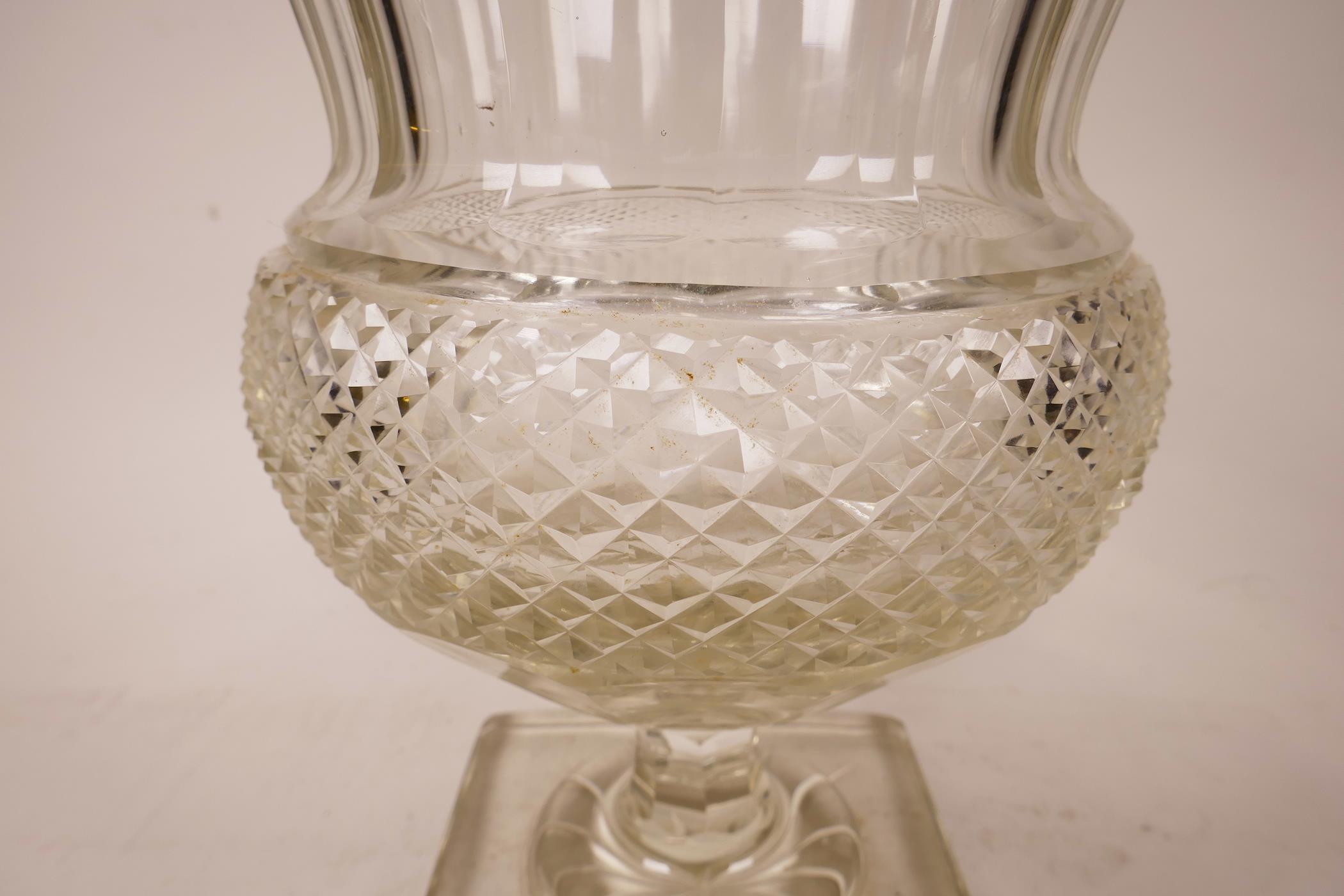 A large Georgian Anglo-Irish diamond cut, lead glass pedestal vase/urn, A starburst cut base, - Image 4 of 5