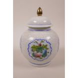 A Chinese blue and white porcelain jar and cover with polychrome enamel panels depicting gourds