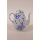 A Japanese blue and white porcelain tea pot with bamboo style spout and handle, 5½" high