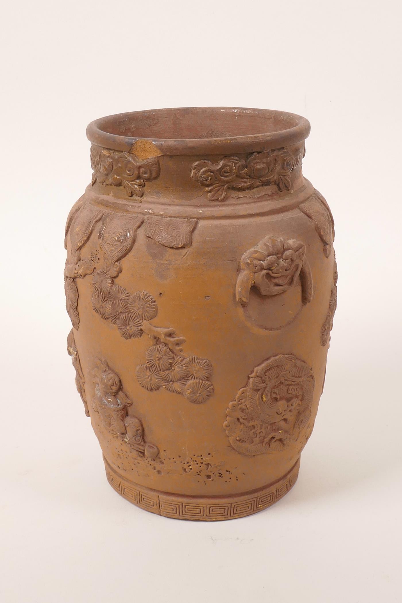 A Chinese earthenware jar with raised decoration of a figure and dragon, A/F losses and chips, 7" - Image 4 of 7