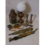 A quantity of brassware including an oil lamp with duplex burner, replica railway lamp, flat iron