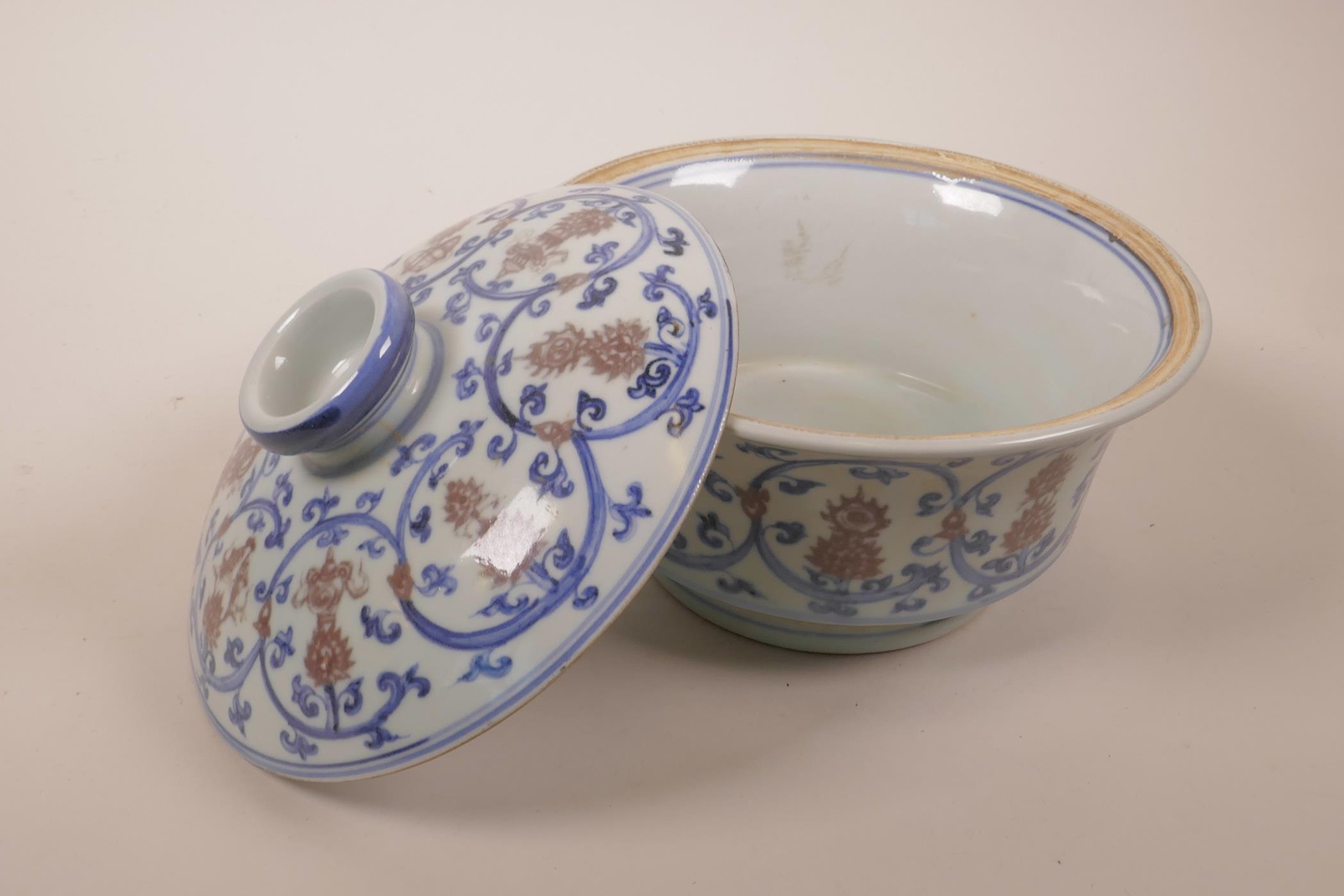 A Chinese blue, white and red porcelain pot and cover decorated with lotus flowers and the emblems - Image 5 of 7