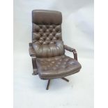 A Swedish leather and faux leather swivel armchair with bentwood arms