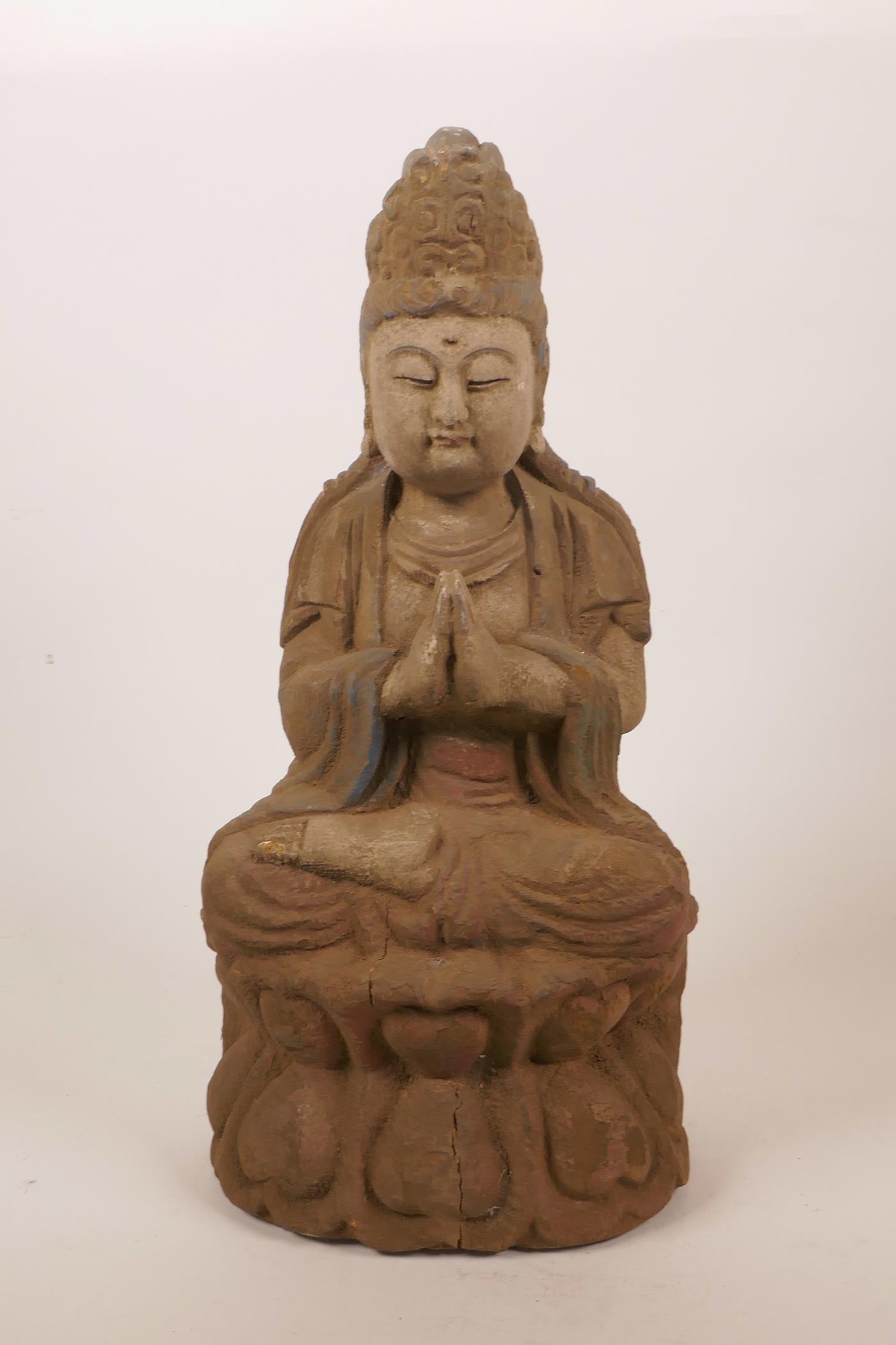 A Chinese carved and painted wood figure of Buddha seated in meditation, 14½" high