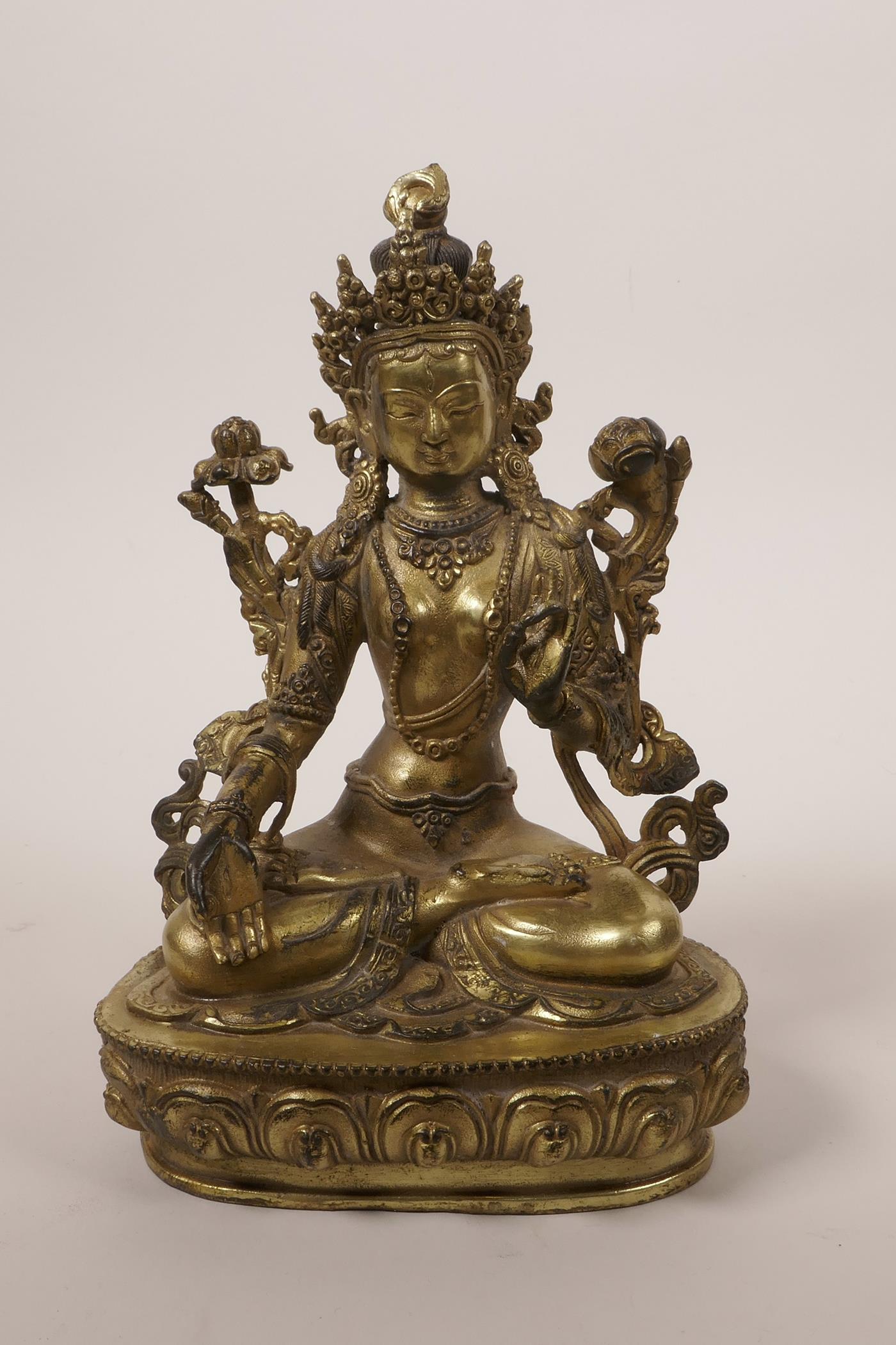 A Chinese gilt bronze Buddha seated on a lotus throne, impressed double vajra mark to base, 8"high